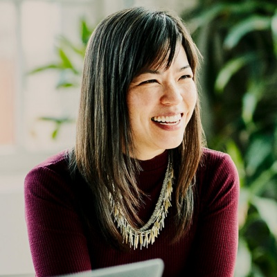 Businesswoman leading meeting in office conference room